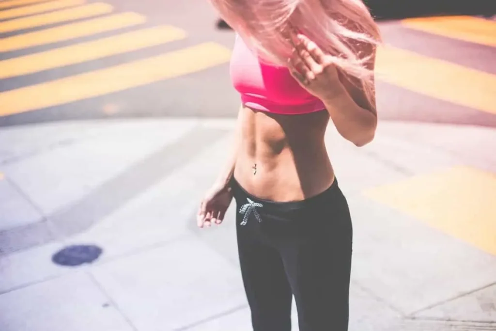 Woman with toned stomach after LA-EMS Body Sculpting Treatment Andover