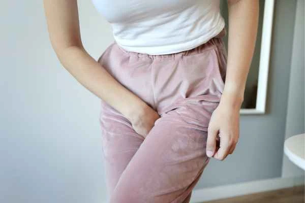 woman running for the toilet because of urinary incontinence Andover
